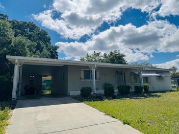 Charming single-story home with a covered carport and well-maintained landscaping at 10081 Sw 93Rd Ave, Ocala, FL 34481