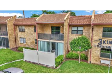 Charming condo with brick facade, balcony and a well-manicured lawn at The 3 Kings Condominiums at 2837 Ne 3Rd St # 103, Ocala, FL 34470