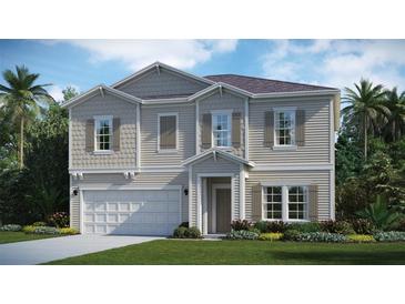 Charming two-story home boasts a landscaped yard, two-car garage, and welcoming entrance at 3211 Ne 40Th Ln, Ocala, FL 34479