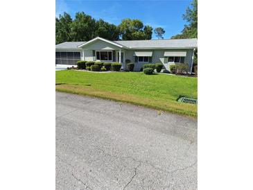 Charming single-story home with well-manicured lawn and mature landscaping, ready for new owners at 8107 Sw 108Th Place Rd, Ocala, FL 34481