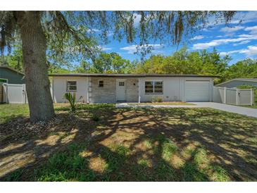 Charming single-story home with a brick accent, new driveway, and beautiful landscaping at 14476 Sw 43Rd Court Rd, Ocala, FL 34473