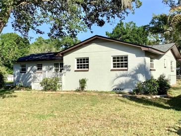 Charming single-story home featuring a cozy front porch and well-maintained landscaping in a serene neighborhood at 2138 Sw 9Th Rd, Ocala, FL 34471