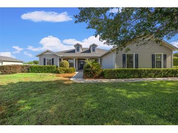 Charming single-story home with well-manicured lawn and mature landscaping at 4735 Se 35Th St, Ocala, FL 34480