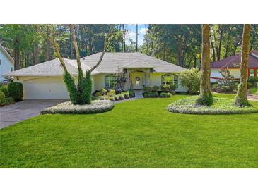 Charming one-story home boasts lush lawn, mature trees, and well-manicured landscaping at 9129 Sw 193Rd Cir, Dunnellon, FL 34432