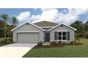 Charming single-story home featuring a gray exterior, attached garage, and well-manicured lawn at 4690 Sw 88Th Ln, Ocala, FL 34476