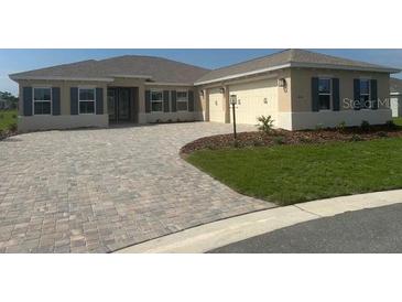 Charming single-Gathering home with a well-manicured lawn and a spacious two-car garage at 10530 Sw 98Th Pl, Ocala, FL 34481