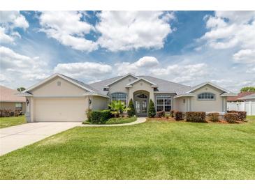 Beautiful one-story home with well-manicured lawn and landscaping at 8170 Sw 56Th Avenue Rd, Ocala, FL 34476