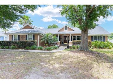 Charming single-story home with lush landscaping and mature trees in a serene setting at 5437 Se 34Th St, Ocala, FL 34480