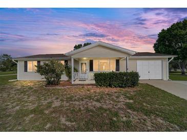Charming single-story home with a manicured front yard and attached garage, perfect for suburban living at 8375 Sw 109Th Lane Rd, Ocala, FL 34481