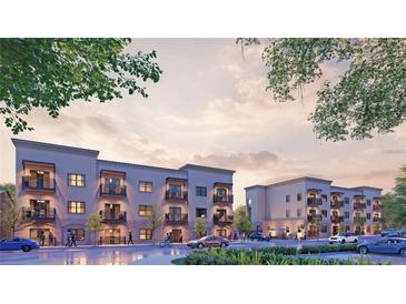 Modern apartments featuring brick accents, balconies, and ample parking, under a soft, inviting sky at 415 Se 1St Ave # 103-B, Ocala, FL 34471