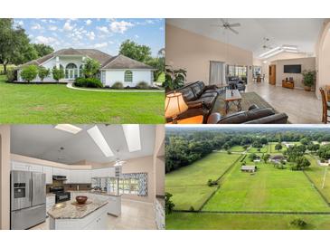 Charming single-story home with a pristine lawn, mature landscaping, and a welcoming entrance at 5661 Nw 96Th Ln, Ocala, FL 34482