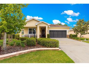Inviting single-story home with manicured landscaping and a well-maintained lawn at 9642 Sw 95Th Loop, Ocala, FL 34481
