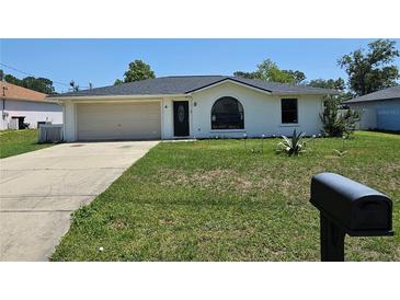 Charming single-story home with a well-maintained lawn and an attached one car garage at 6 Bahia Trace Loop, Ocala, FL 34472