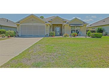 Charming single-story home with a well-maintained lawn and inviting curb appeal at 14004 Se 94Th Ave, Summerfield, FL 34491