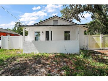 Charming renovated single-Gathering home with a quaint porch and a well-maintained, fenced yard at 719 Nw 8Th St, Ocala, FL 34475