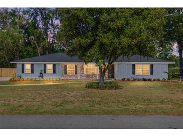 Charming single-story home featuring a brick facade and mature landscaping at 1812 Se 38Th Ave, Ocala, FL 34471