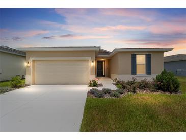 Charming single-story home with a well-manicured lawn and beautiful landscaping, plus a two car garage at 5842 Sw 78Th Avenue Rd, Ocala, FL 34474