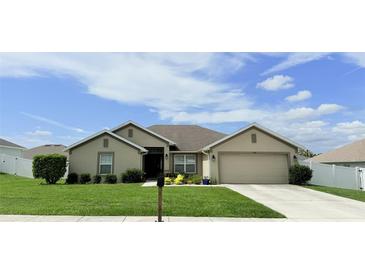 Charming single-story home featuring a well-manicured lawn and a two-car garage at 186 Nw 44Th St, Ocala, FL 34475