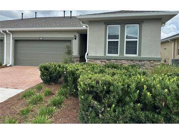 Charming home with a well-manicured lawn and a two-car garage, offering curb appeal and convenience at 5255 Nw 33Rd Pl, Ocala, FL 34482