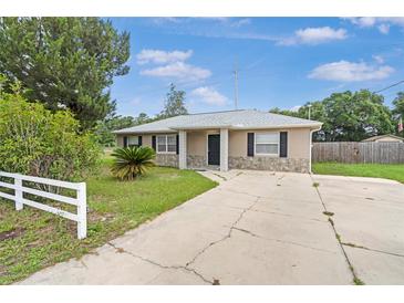 Charming single-story home with a well-maintained front yard, stone accents, and a cozy entrance at 4250 Nw 26Th Ter, Ocala, FL 34475