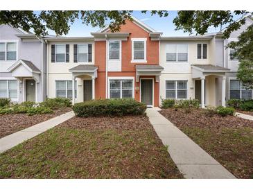 Charming townhome with a colorful facade, well-maintained landscaping, and inviting entryway at 4429 Sw 49Th Ave, Ocala, FL 34474