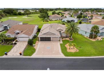 Beautiful single-Gathering home with a well-manicured lawn and a two-car garage in a desirable community near a golf course at 15549 Sw 11Th Terrace Rd, Ocala, FL 34473