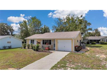 Charming single-story home with well-maintained lawn and inviting front porch at 8144 Sw 108Th Street Rd, Ocala, FL 34481