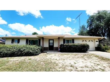 Charming single-story home featuring a neutral exterior, tidy landscaping, and an attached one-car garage at 16905 Sw 30Th Avenue Rd, Ocala, FL 34473