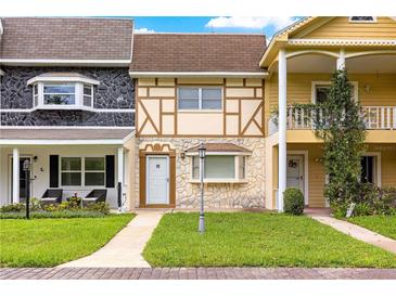 Charming townhouses featuring unique facades, manicured lawns, and inviting entrances at 8830 Sw 98Th Pl # M, Ocala, FL 34481