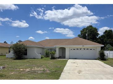 Charming single-story home with an attached garage, a well-maintained lawn and inviting curb appeal at 15084 Sw 28Th Terrace Rd # 3, Ocala, FL 34473