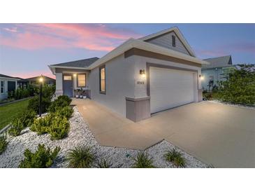Charming single-story home featuring a two-car garage, well-maintained landscaping, and neutral color palette at 8905 Sw 76Th Ln, Ocala, FL 34481