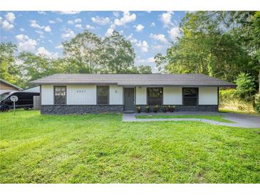 Charming single-story home with a well-maintained lawn and inviting curb appeal at 6021 Nw 54Th Ter, Ocala, FL 34482