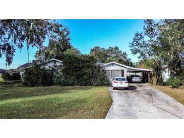Ranch-style home with carport and spacious yard at 1329 Mount Pisgah Rd, Fort Meade, FL 33841