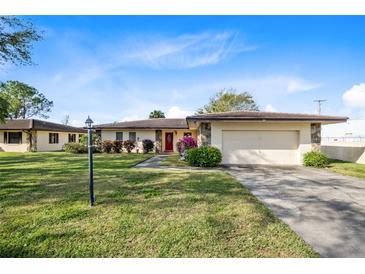 Single-story home with attached garage and well-manicured lawn at 25 Aviation Dr, Winter Haven, FL 33881