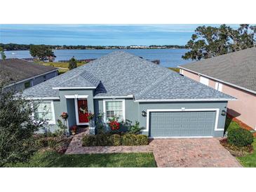 House with lake view and gray exterior at 4062 Bedford Ave, Winter Haven, FL 33884