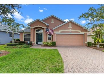 Attractive single-story house with a two-car garage and well-maintained lawn at 4068 Carteret Dr, Winter Haven, FL 33884