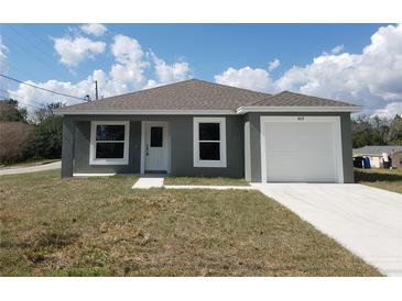 Charming single-story home featuring a one-car garage and well-maintained front yard at 809 Lincoln St, Babson Park, FL 33827