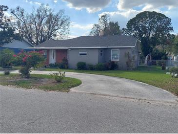 Charming single-story home with a well-maintained lawn and circular driveway at 108 Prospect Ave, Winter Haven, FL 33880