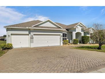 Single-story house with three-car garage and paved driveway at 176 Brookshire Dr, Lake Wales, FL 33898