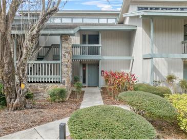 Condo building exterior with walkway and landscaping at 4131 Abbey Ct, Haines City, FL 33844