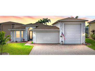 Attractive one-story home with a large garage and well-manicured lawn at 4240 Dunmore Dr, Lake Wales, FL 33859