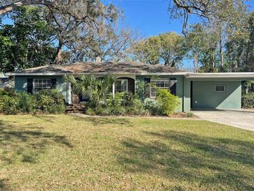 Charming single-story home featuring mature trees and a well-maintained lawn at 618 Chester Dr, Lakeland, FL 33803