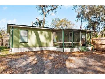 Charming home featuring a screened-in porch perfect for enjoying the outdoors at 519 Sharon Hill Ct, Winter Haven, FL 33880