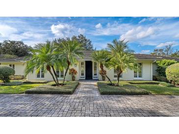 Charming home featuring professional landscaping and a beautiful paved driveway and entryway at 2300 N Scenic Hwy # 89, Lake Wales, FL 33898