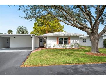 Charming single-story home with a well-maintained lawn and cozy carport at 513 Kelsey St # 513, Lakeland, FL 33803