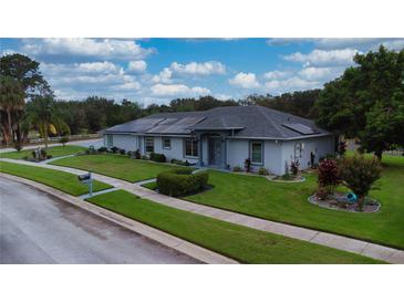 Charming single-story home with well-manicured lawn and inviting curb appeal at 217 Kent Ct, Haines City, FL 33844