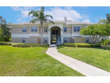 Charming two-story condo with manicured lawn and a welcoming walkway at 1602 Eagle Pond Dr # 1602, Winter Haven, FL 33884