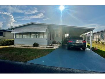 Charming single-story home with covered parking and well-maintained landscaping at 2055 S Floral Ave # 11, Bartow, FL 33830
