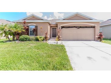 Charming single-story home with well-maintained lawn and tropical landscaping at 249 Haines Blvd, Winter Haven, FL 33881