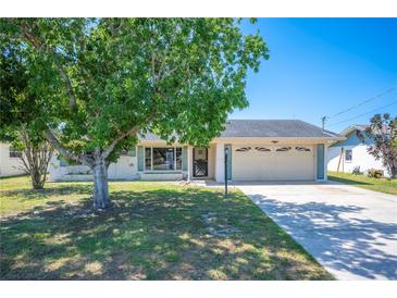 Charming single-story home with a well-manicured lawn and an attached two-car garage at 109 Pasco Se Rd, Winter Haven, FL 33884